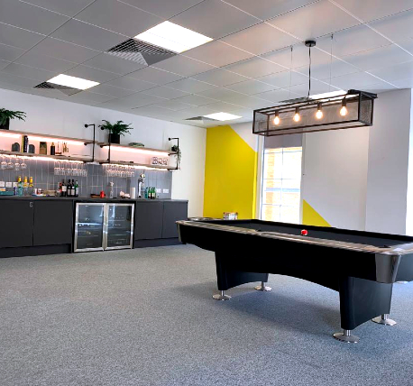 Office break area with kitchen and pool table