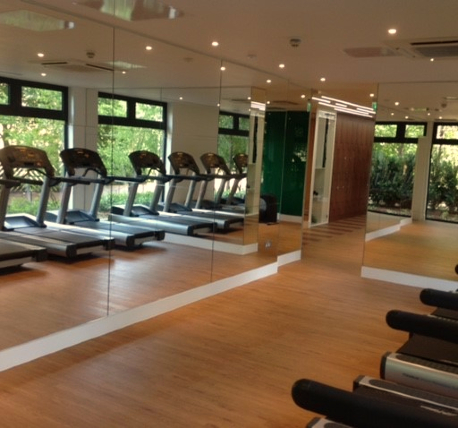 Gym with treadmills and mirrored wall