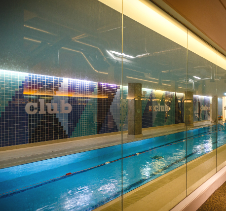 Glazed partition wall looking on to the swimming pool