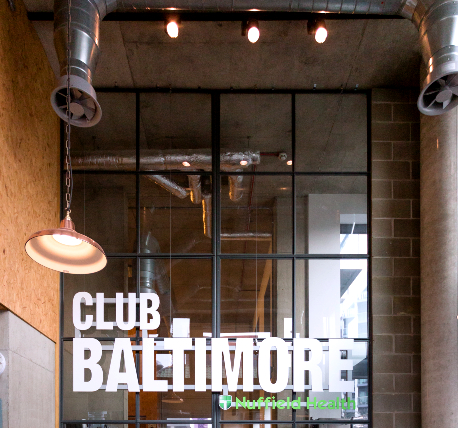 Feature glazing with club signage and hanging light