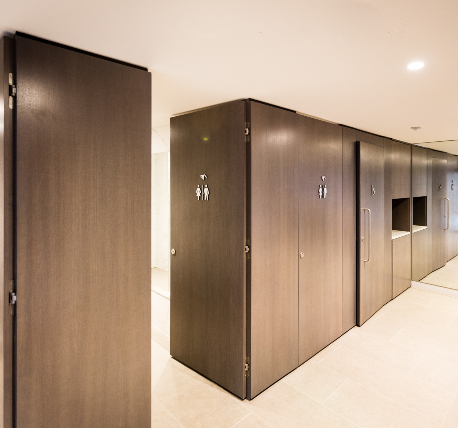 toilet cubicles with mixed usage signs