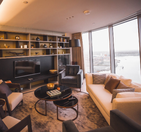 Livingroom with sofa and media unit overlooking the River Thames