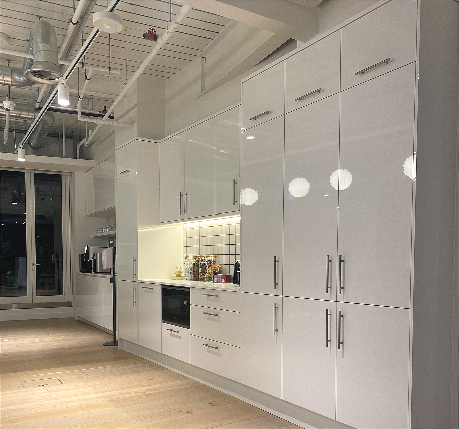Office kitchen space with tall storage in white gloss